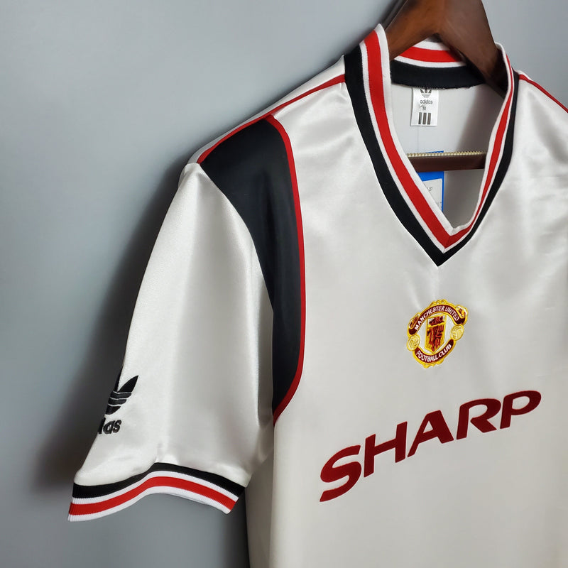 MANCHESTER UNITED II 1985 HOMBRE (RETRO) - TIENDA DEL JUGADOR